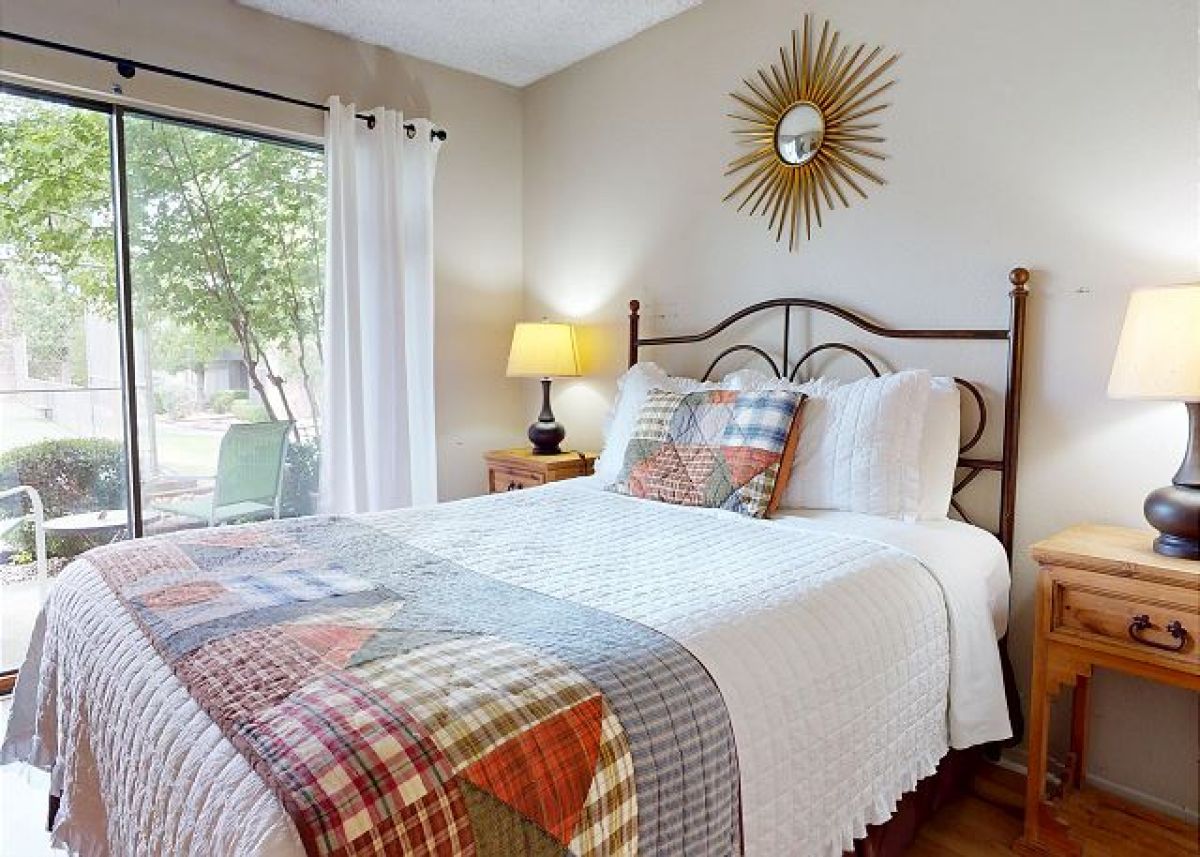 Queen size bed in the primary bedroom