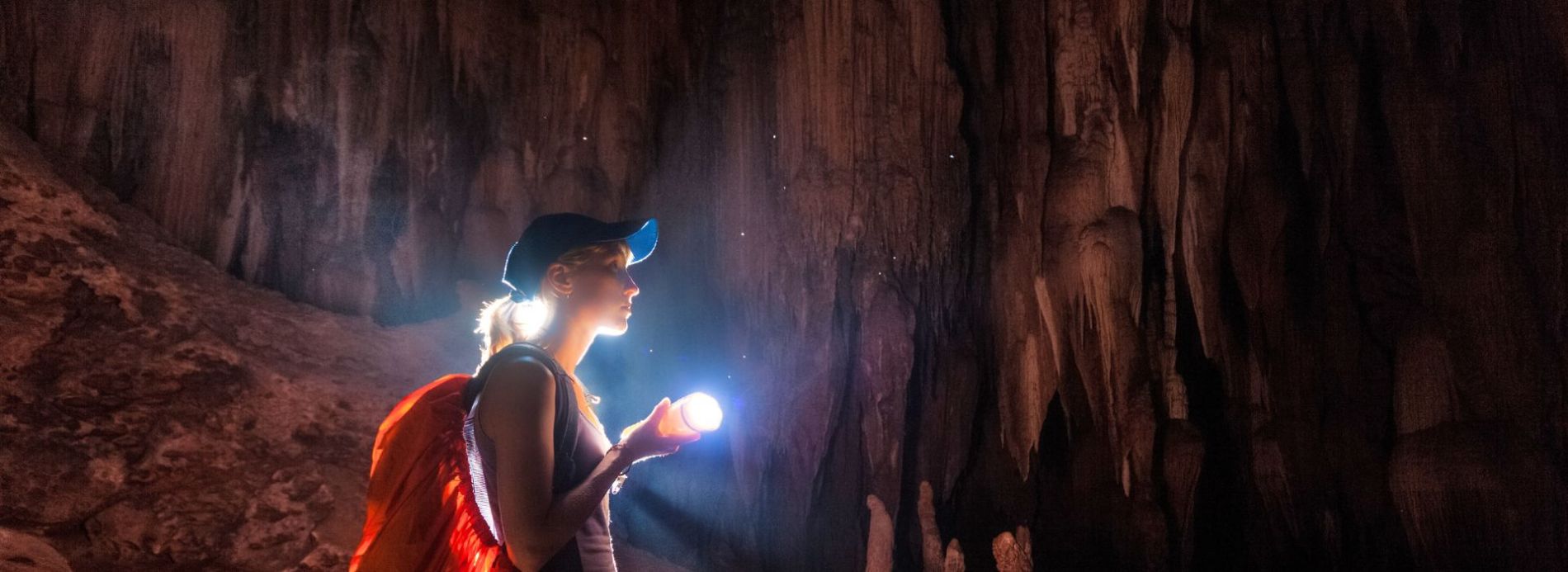 woman exploring caverns